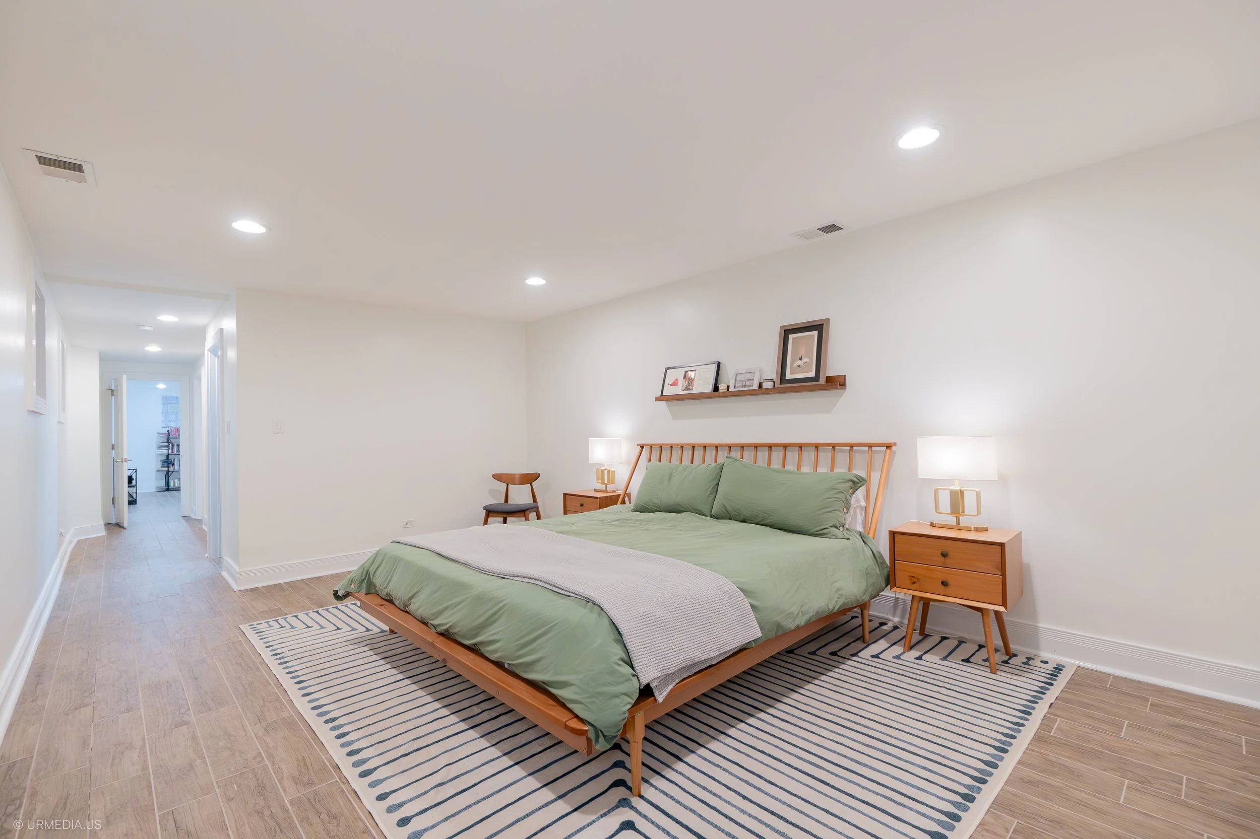 Primary Bedroom Keep nightstands clear except for one or two simple items like a lamp or a small plant. Make the bed with neutral bedding, and remove any personal items like photos or clothing. Ensure closets are organized, as buyers may look inside to gauge storage space.